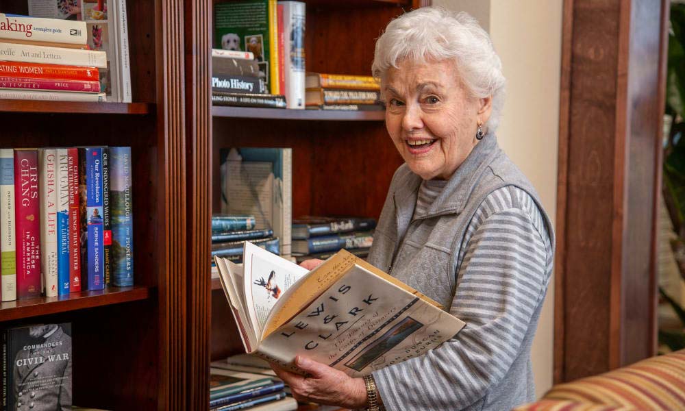 Independent senior near Indianapolis selecting a book