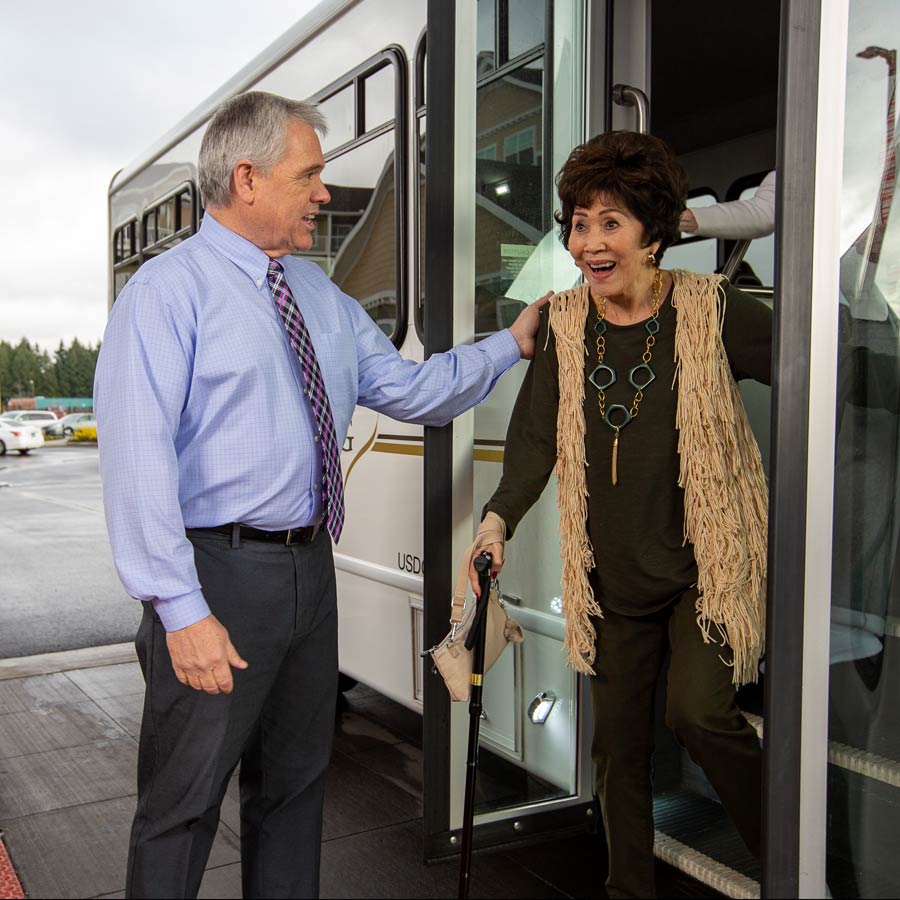 NorthRidge helping lady off bus
